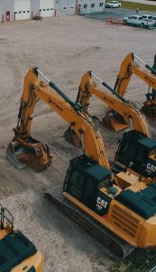 A row of idle Strike excavators